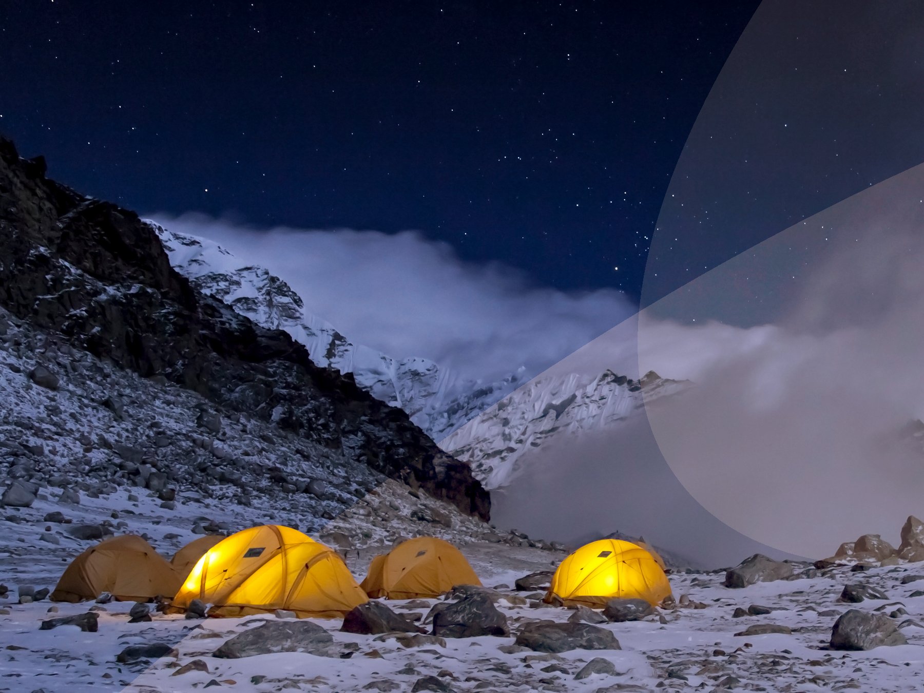 Tents lit up at night at the Mera Peak base camp in Nepal.