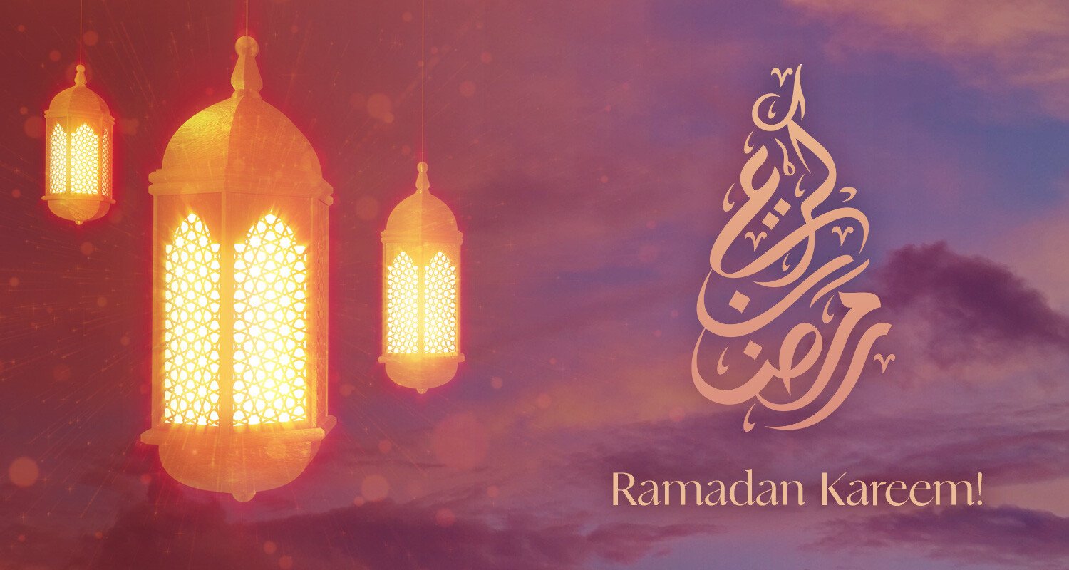 A set of ornate golden lanterns glow warmly against a soft pink and purple evening sky. Light radiates outward, creating a peaceful atmosphere. Beside them, elegant Arabic calligraphy spells out 'Ramadan Kareem,' blending tradition with a modern aesthetic.